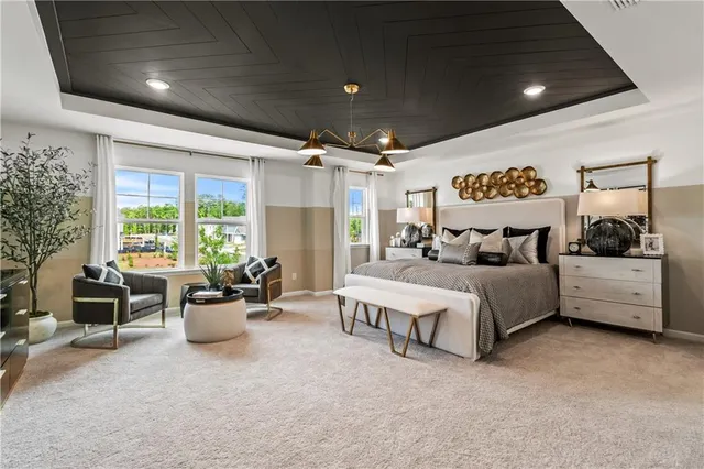 a bedroom with furniture and a chandelier