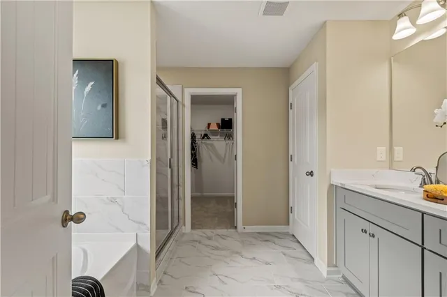 a bathroom with a double vanity sink and a mirror