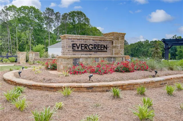 a view of a patio with a table and chairs and potted plants