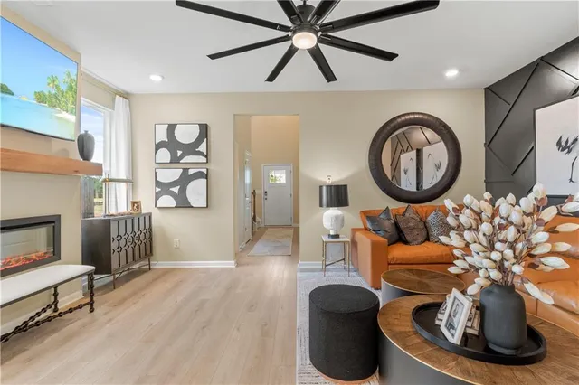 a living room with furniture and a fireplace