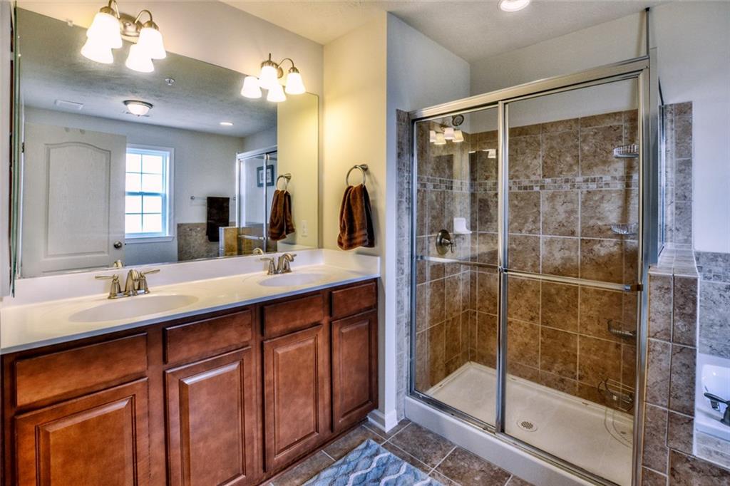 1 Truman Circle McKees Rocks, PA 15136 - Photo 17 of 25 Master bathroom with double bowl vanity, walk-in shower and a soaking tub