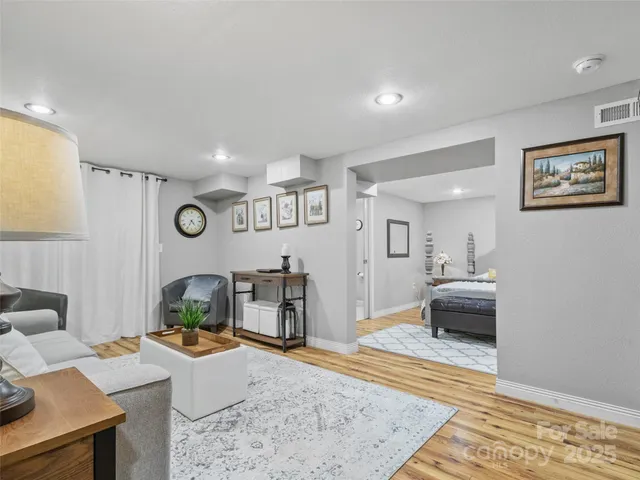 a living room with furniture and a table