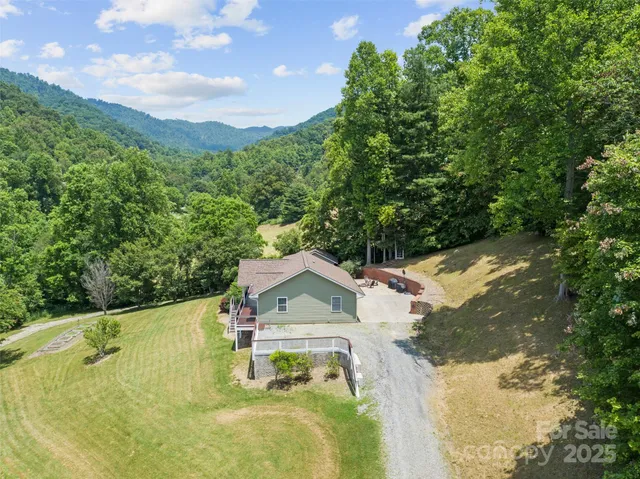 an aerial view of a house with outdoor space