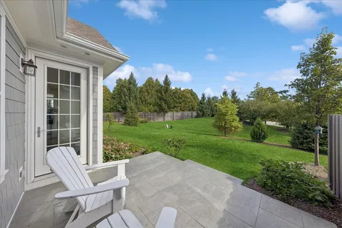 a view of a house with backyard and a garden
