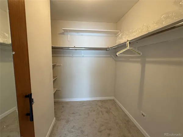 a view of an empty walk in closet