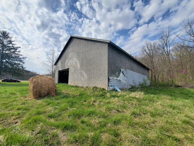 a backyard of a house with lots of green space