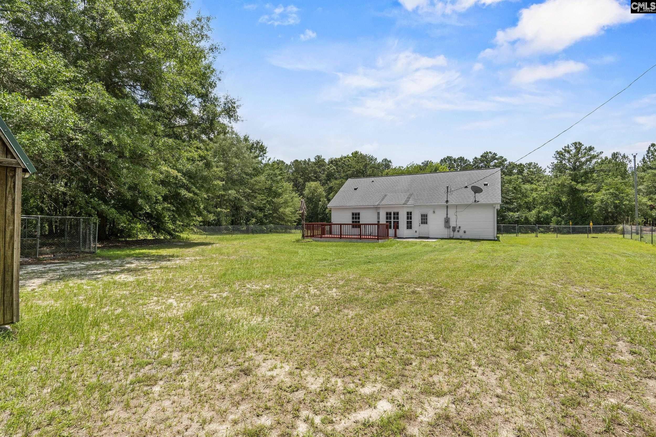 548 Eskie Dixon Road Elgin, SC 29045 - Photo 27 of 27 a view of a house with yard and trampoline