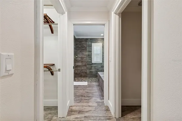 a view of a patio with table and chairs with wooden floor and fence