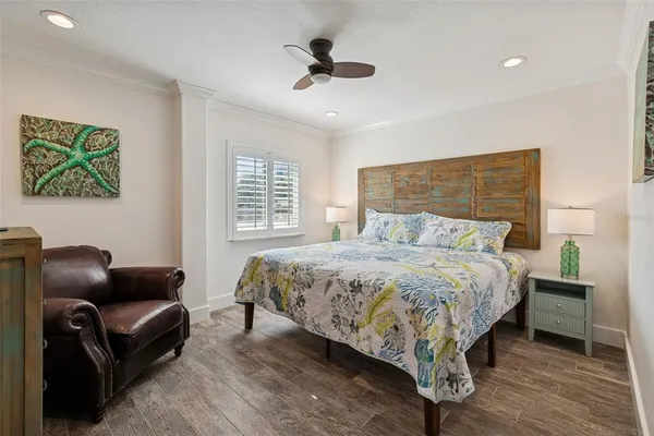 an aerial view of a house with swimming pool and patio