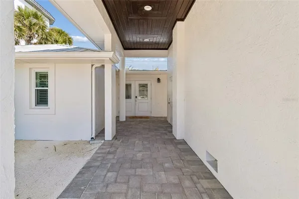 a kitchen with stainless steel appliances granite countertop a refrigerator a sink a stove and cabinets