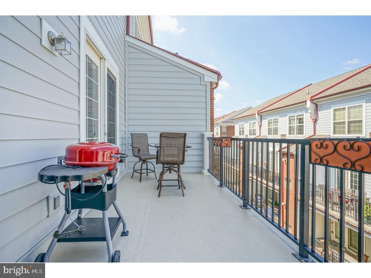 508 Captains Way Philadelphia, PA 19146 - Photo 11 of 25 a patio with table and chairs and a barbeque