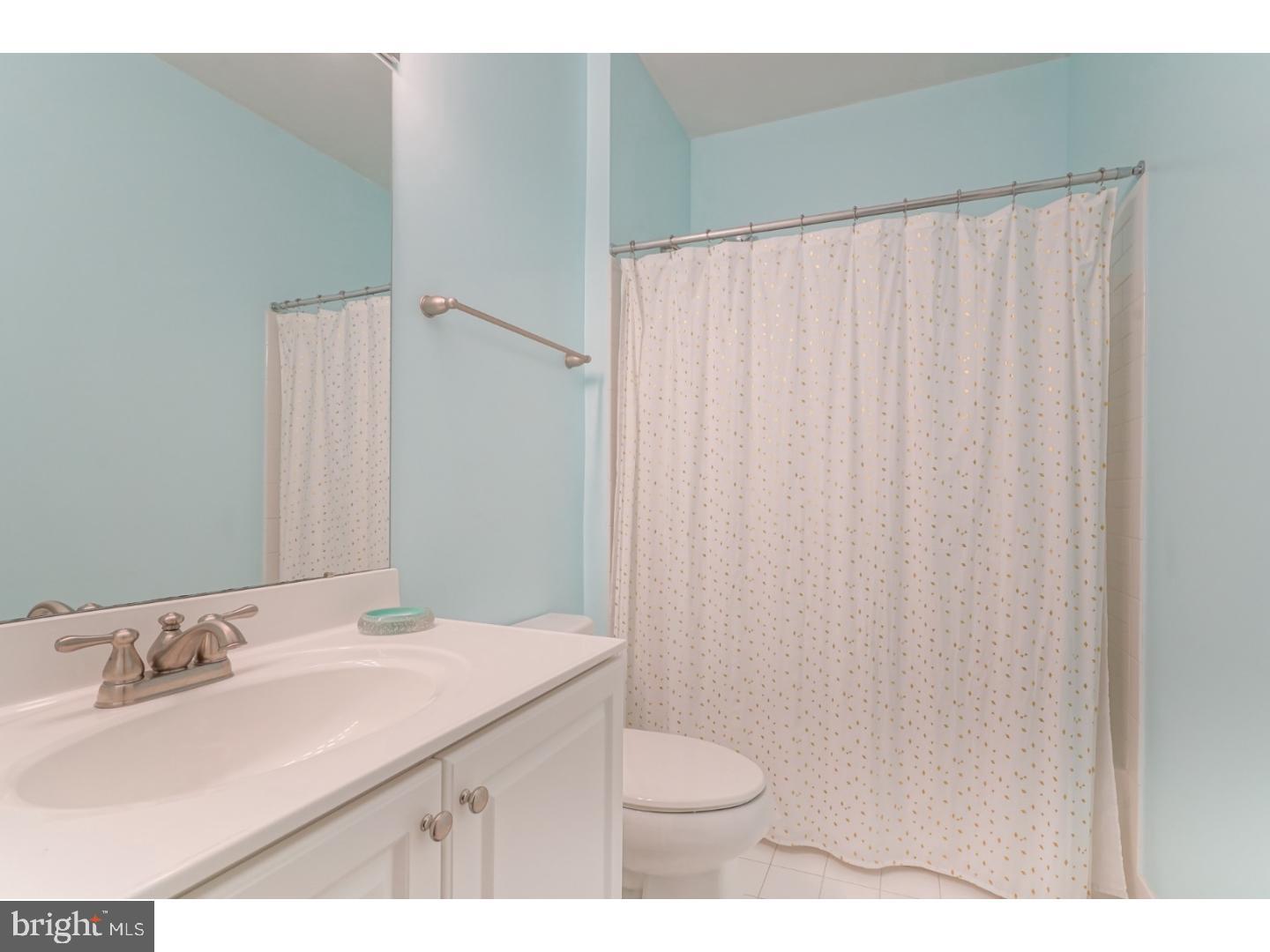 508 Captains Way Philadelphia, PA 19146 - Photo 18 of 25 a bathroom with a sink and a mirror