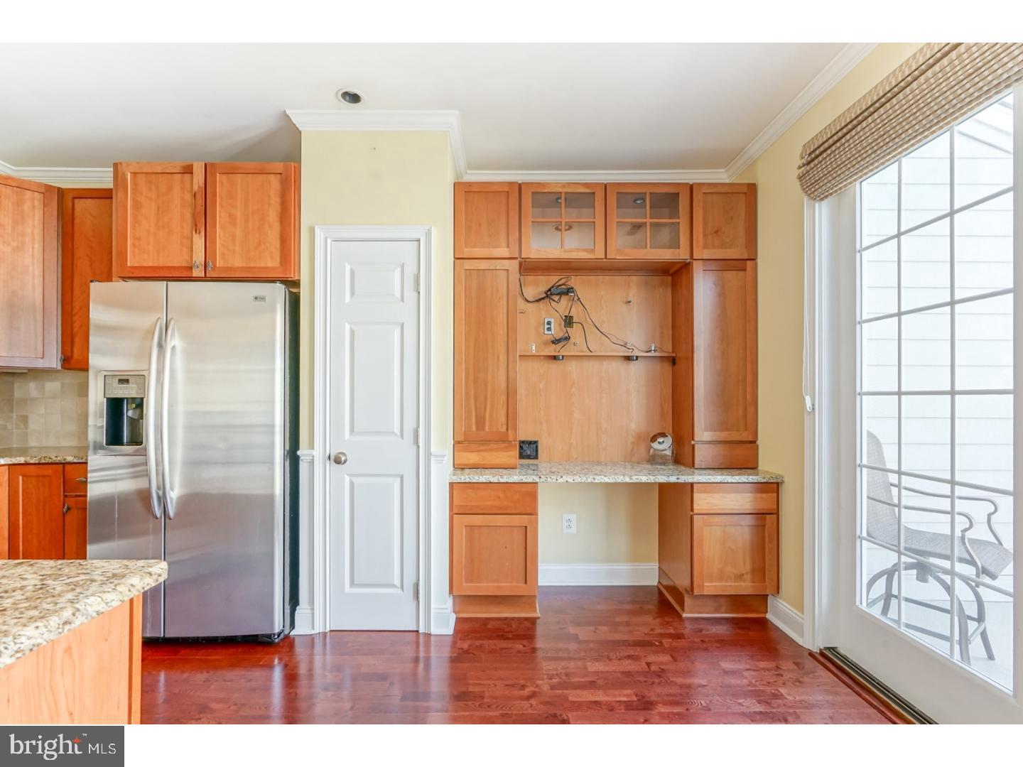 508 Captains Way Philadelphia, PA 19146 - Photo 8 of 25 a kitchen with stainless steel appliances granite countertop a refrigerator and a stove top oven