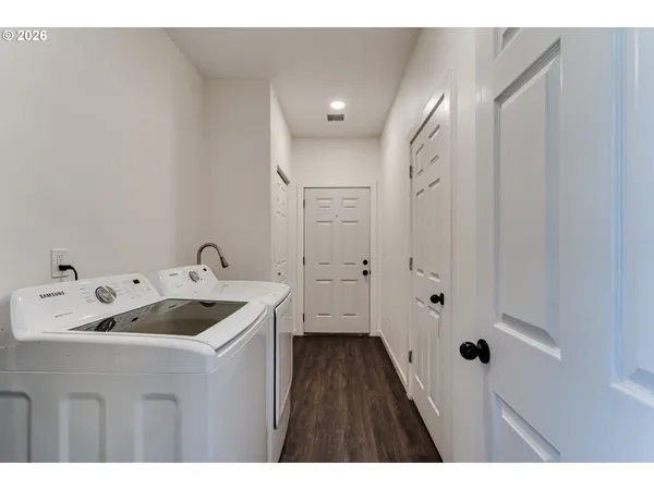 a bathroom with a sink and mirror with toilet