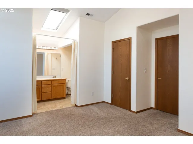 a room with a bed and a bathroom