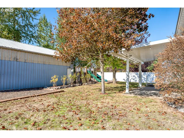 a backyard of a house with lots of green space
