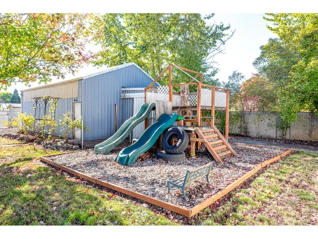 a view of a wooden deck with a backyard