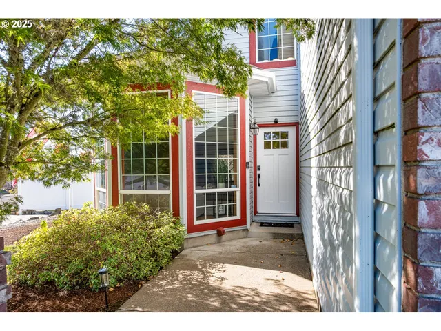 a view of a house with a door and balcony