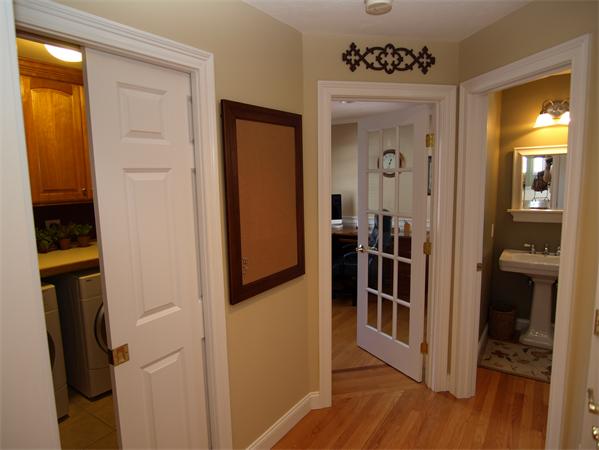 151 Green Road Bolton, MA 01740 - Photo 13 of 28 a view of a hallway with wooden floor and closet