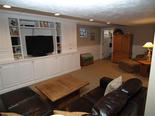 151 Green Road Bolton, MA 01740 - Photo 24 of 28 a living room with furniture and a flat screen tv