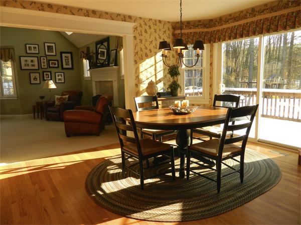 151 Green Road Bolton, MA 01740 - Photo 8 of 28 a view of a dining room with furniture window and wooden floor