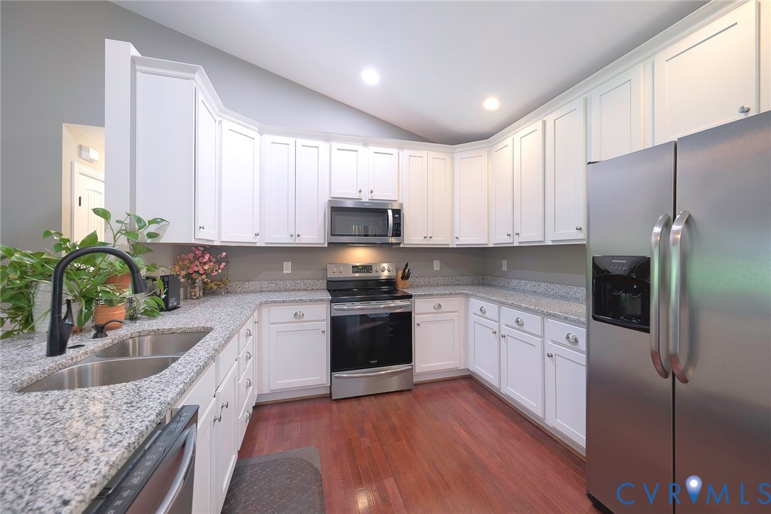 19151 Poor House Road Amelia Court House, VA 23002 - Photo 10 of 39 U-shaped kitchen with white cabinetry, granite cou