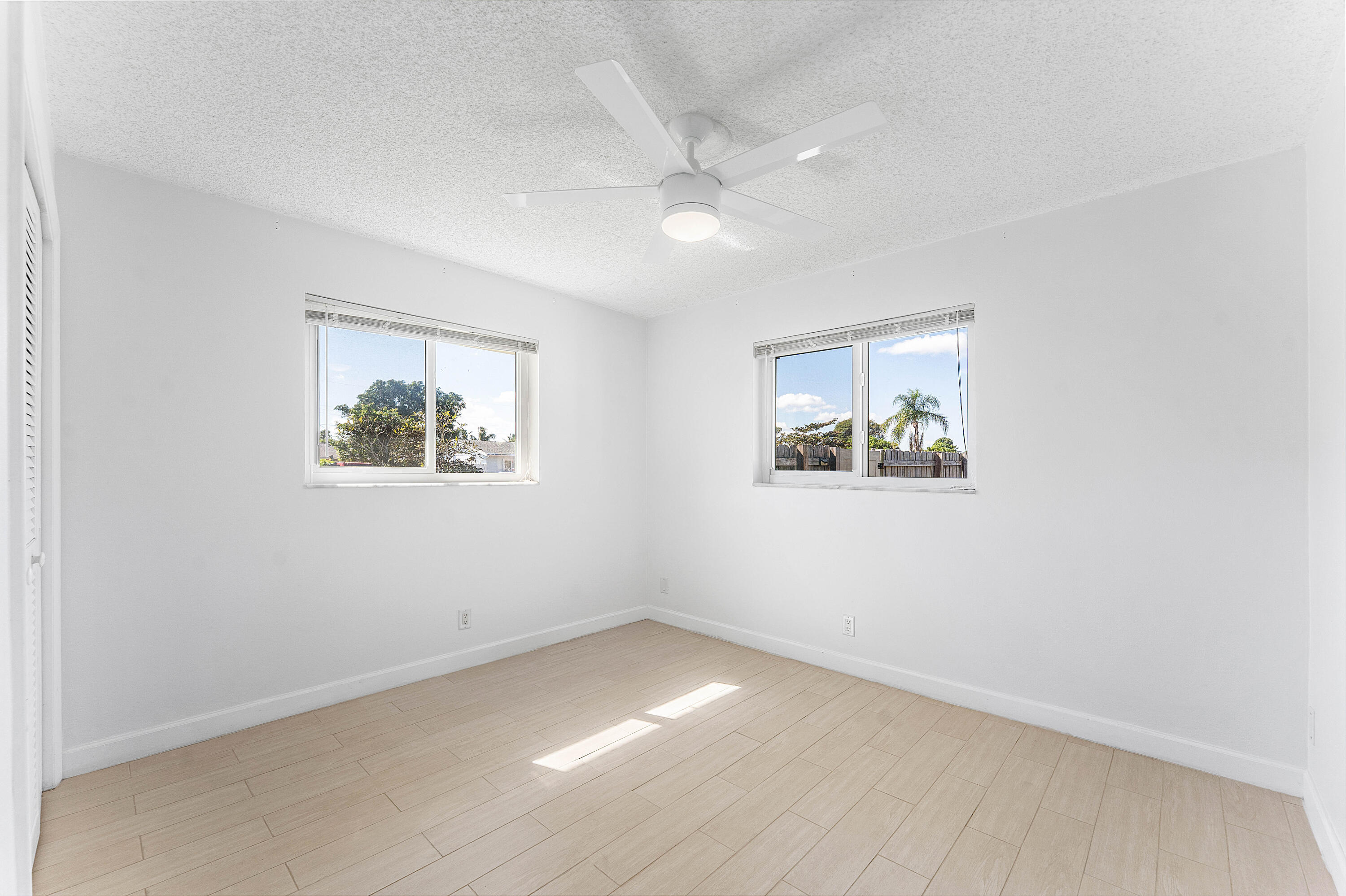 7643 Overlook Road Lake Worth, FL 33462 - Photo 15 of 29 an empty room with a window