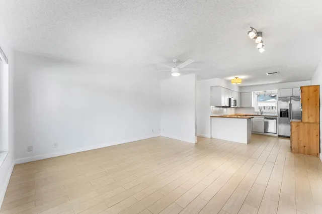 a view of kitchen with wooden floor