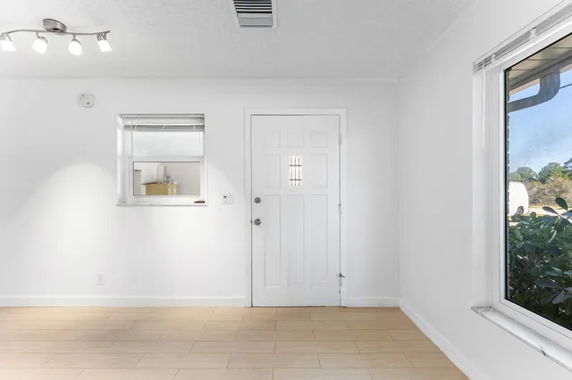 an empty room with windows