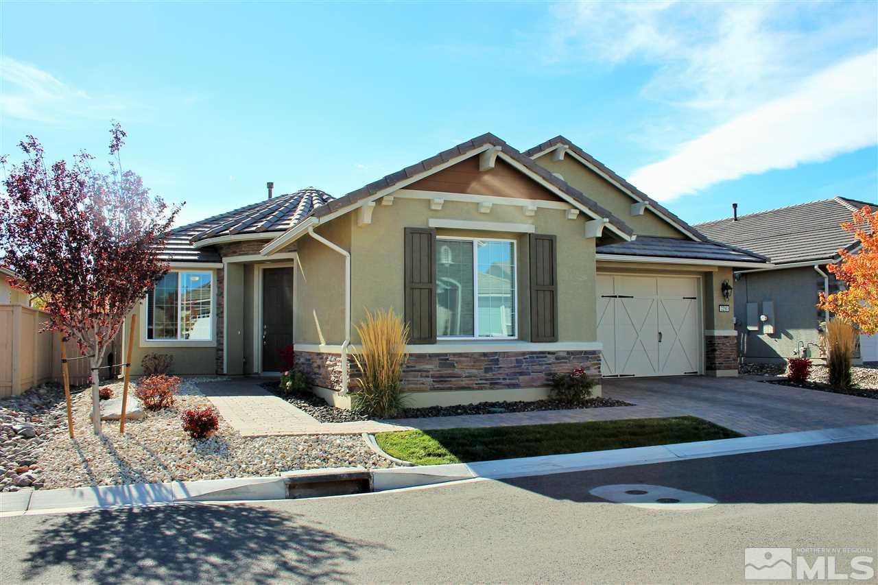 2290 Trakehner Lane Reno, NV 89521 - Photo 1 of 18 a front view of a house with a yard