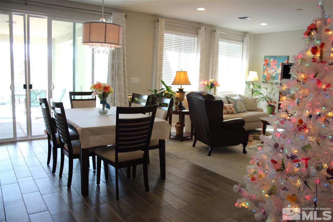 2290 Trakehner Lane Reno, NV 89521 - Photo 3 of 18 a view of a dining room with furniture and wooden floor