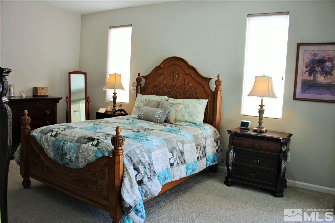 2290 Trakehner Lane Reno, NV 89521 - Photo 8 of 18 a bedroom with a bed and window