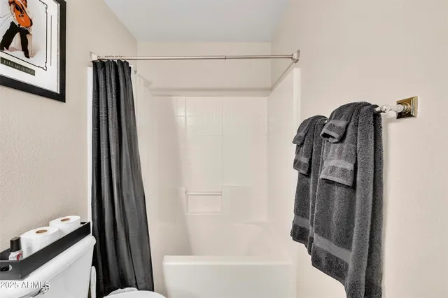 a bathroom with a tub and a shower