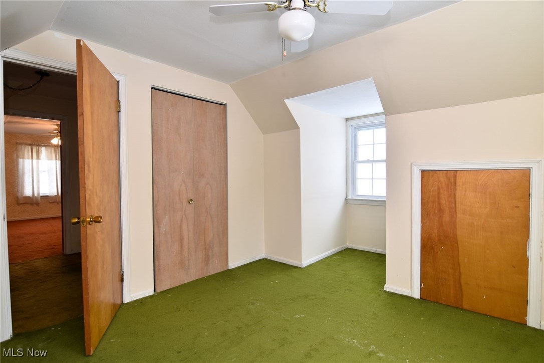 6308 Highland Road Cleveland, OH 44143 - Photo 34 of 40 Additional living space with carpet, vaulted ceiling, baseboards, and ceiling fan