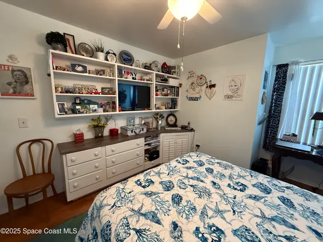 a white toilet sitting next to a bath tub and a shower
