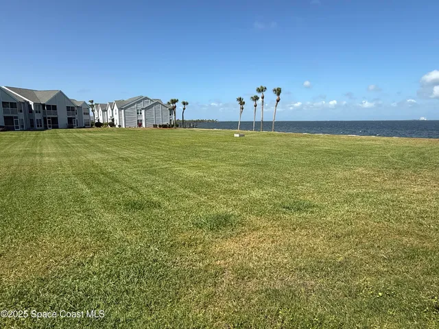 a roof deck with a table and chairs