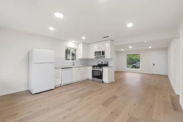 a view of kitchen with wooden floor