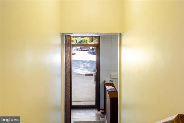 a bathroom with a shower and a glass door