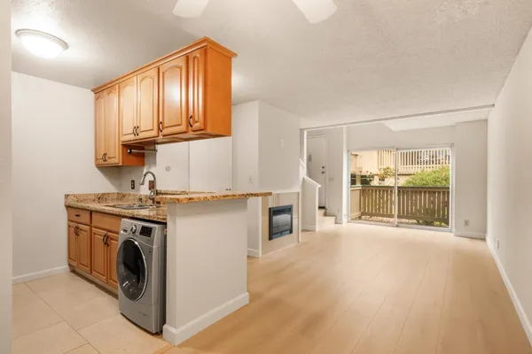 a view of a kitchen with washer and dryer