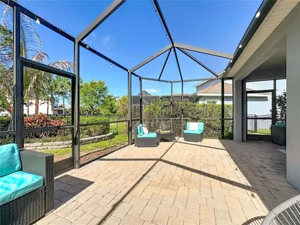 a house view with a sitting space and glass windows