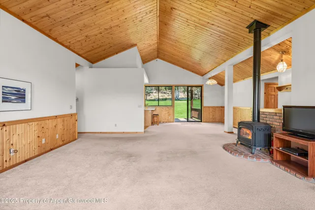 a view of an empty room and a window