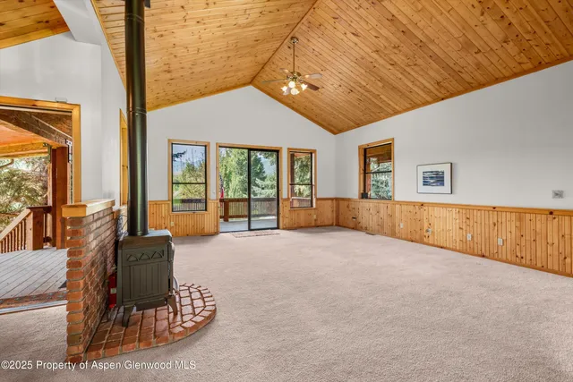 a large room with furniture and large windows