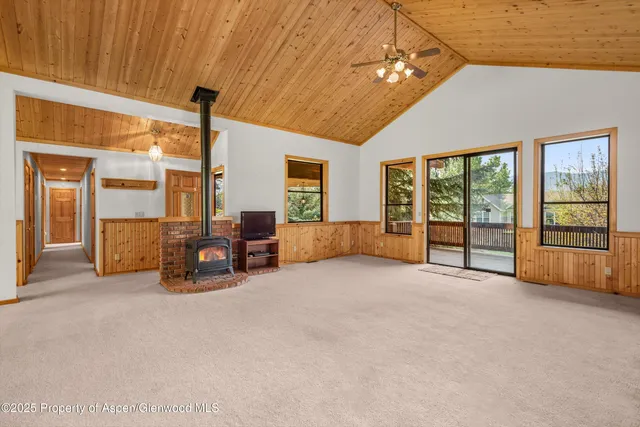 a big room with furniture and a chandelier