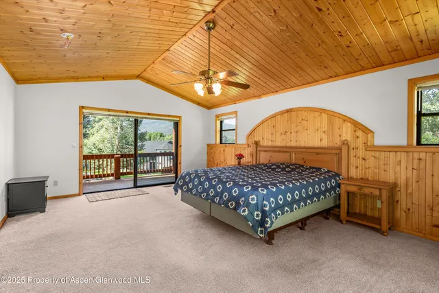 a bed sitting in a room next to a window