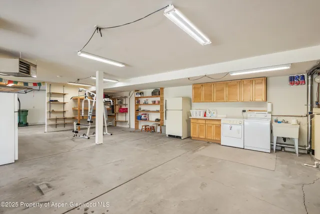 a view of a storage & utility room with lots of appliances