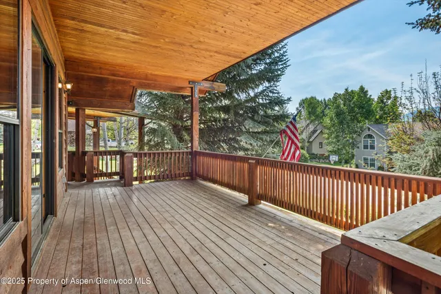 a view of deck with wooden floor and outdoor seating
