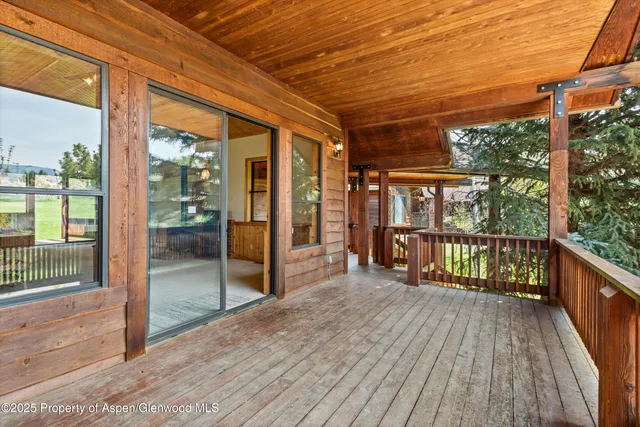 a view of a balcony with wooden floor