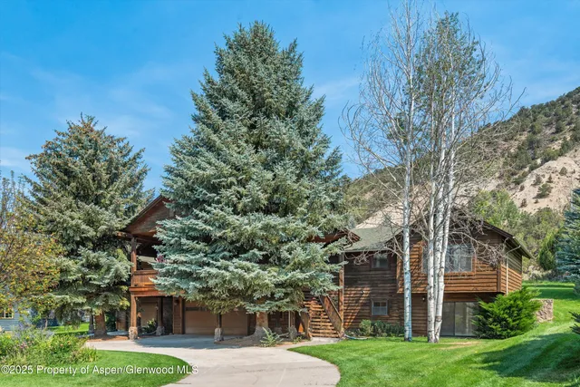aerial view of a house with a yard