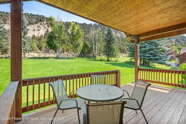 a view of a two chairs in the deck