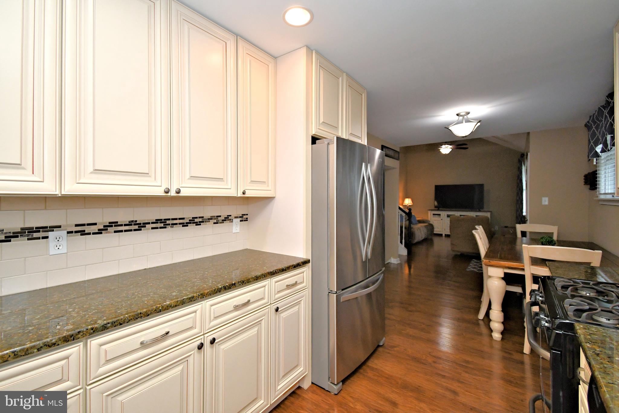 701 Cypress Road Warminster, PA 18974 - Photo 20 of 52 a kitchen with stainless steel appliances granite countertop a refrigerator and a stove top oven